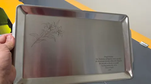 Custom engraved stainless steel serving platter featuring a detailed lily flower illustration and personalized message.