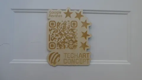 Laser cut basswood counter sign with a custom etched Google Reviews QR code and five star business rating.